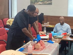 Woman practising wound packing 